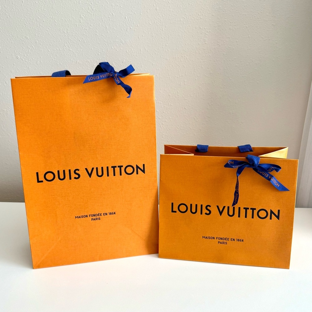 Authentic Louis Vuitton shopping bags with ribbons
